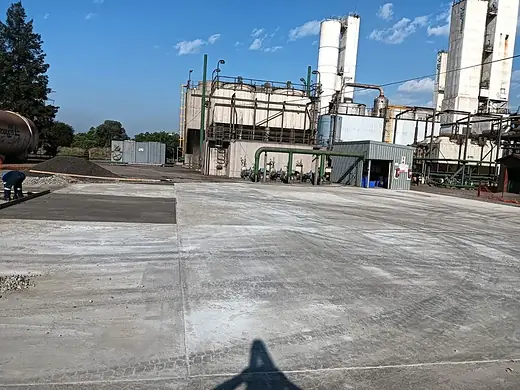 Concrete apron cast alongside a working plant