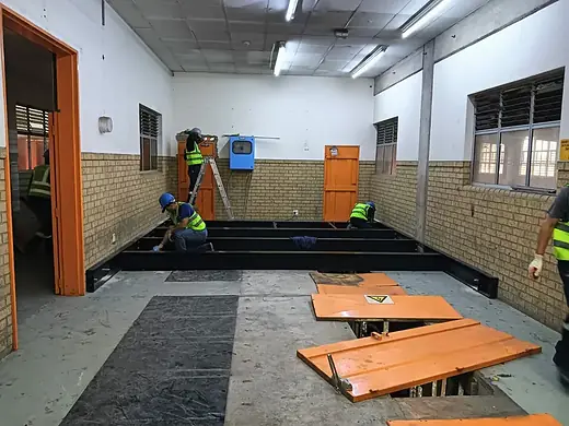 False floor being installed over an inspection pit